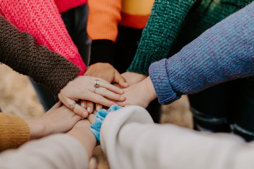 Helping Hands - World Happiness Report Unsplash