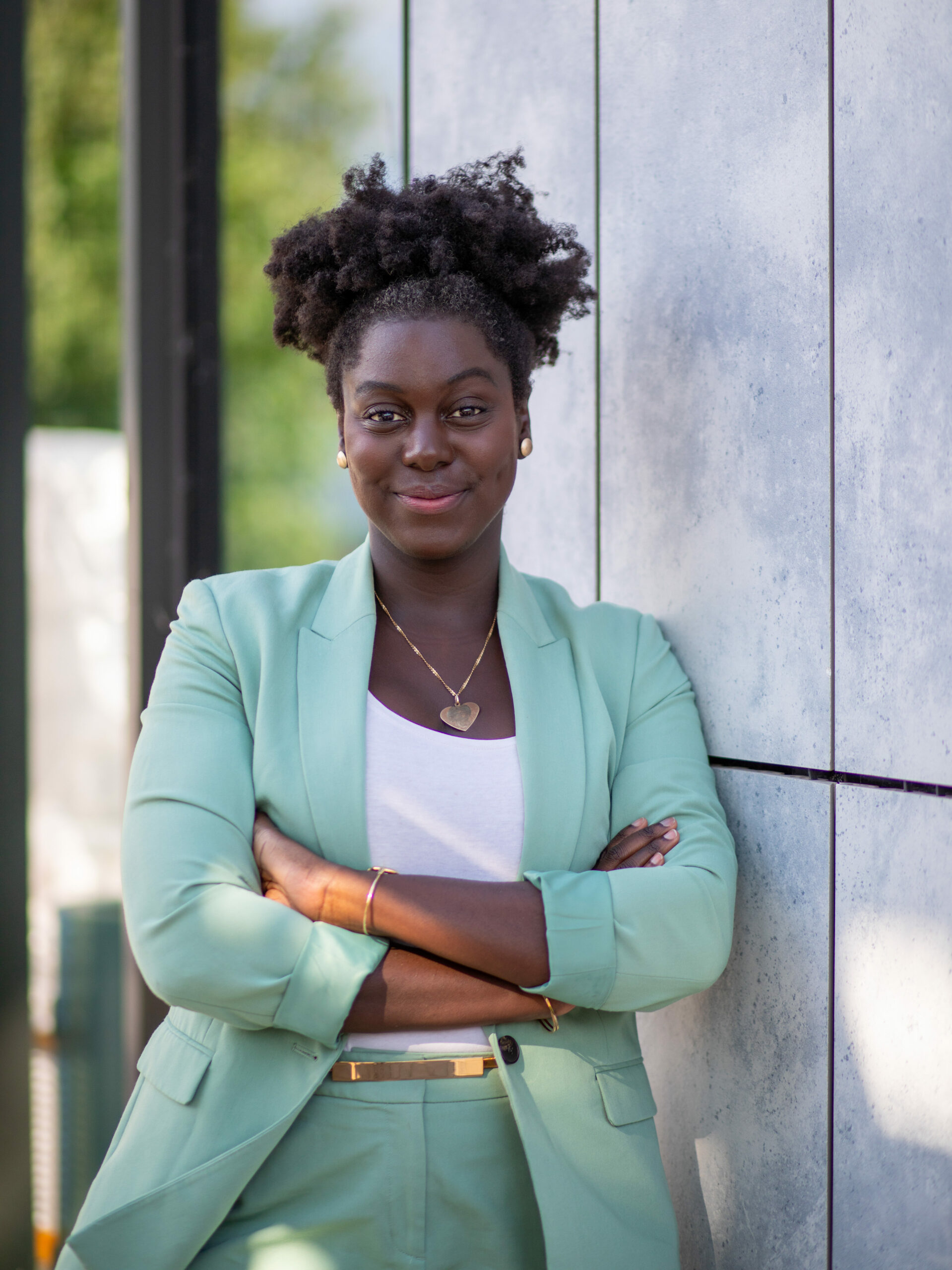 a woman in a green suit